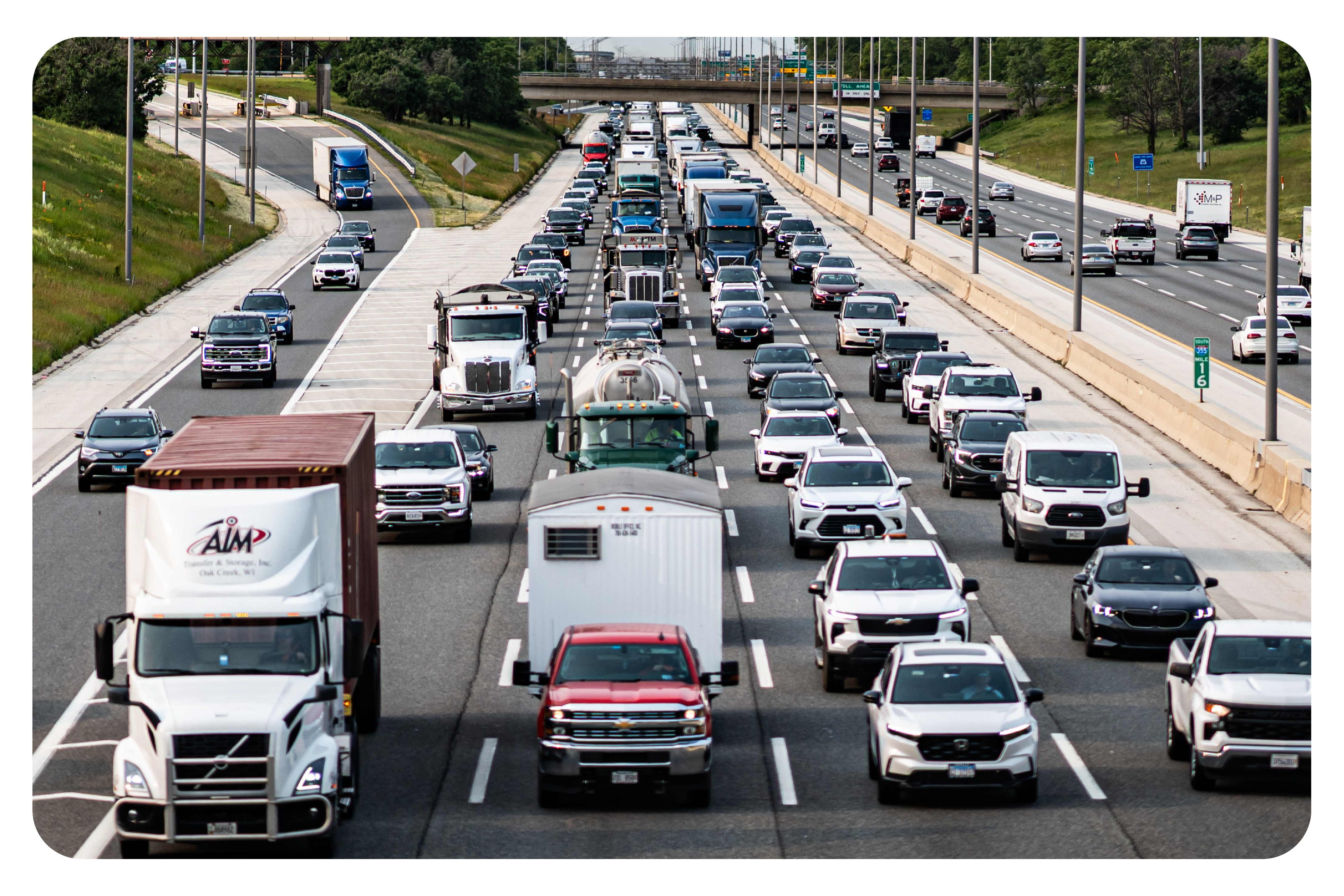 Cars and trucks driving on Illinois Tollway roadway